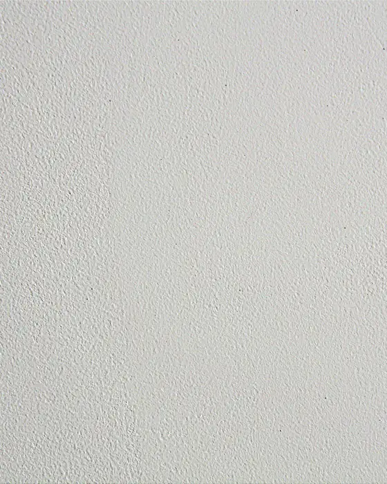 A smooth painted wall surface, close up, showing an even matt finish.
